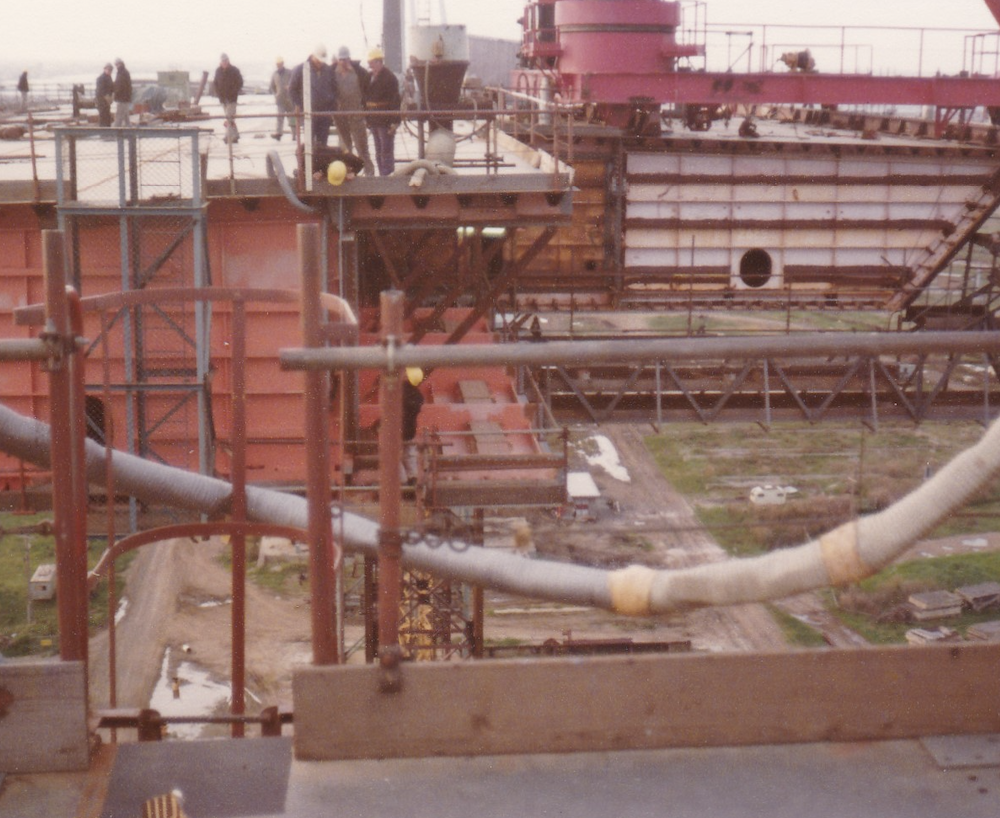 Workers on top of the bridge